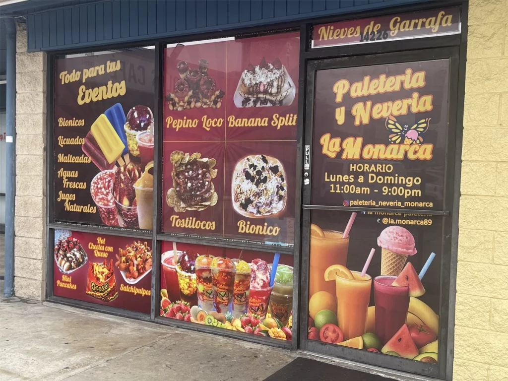 Custom storefront window graphics for La Monarca business